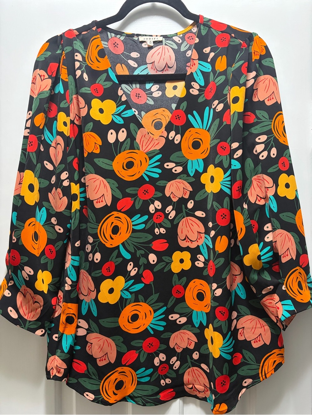 JODIFL Black Floral V-Neck Blouse with Orange & Yellow Accents